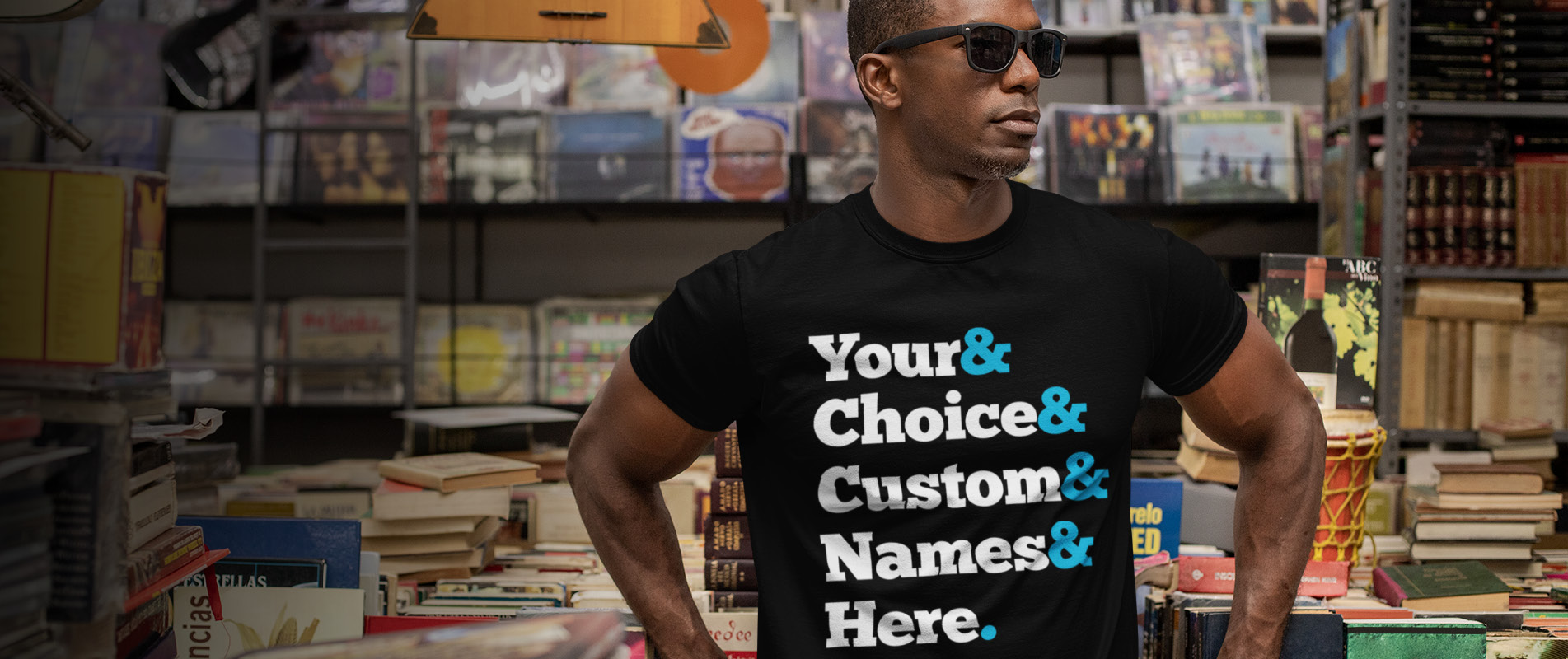 Man in record shop wearing generic ampersand t shirt